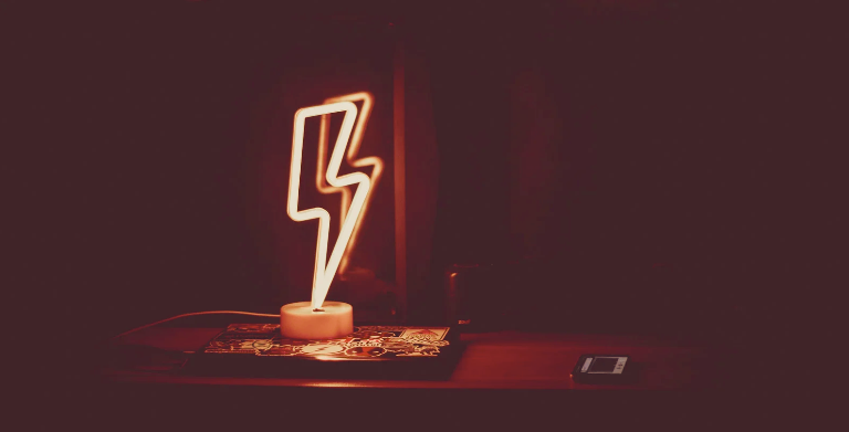 muted image of lightning bolt shaped neon lamp